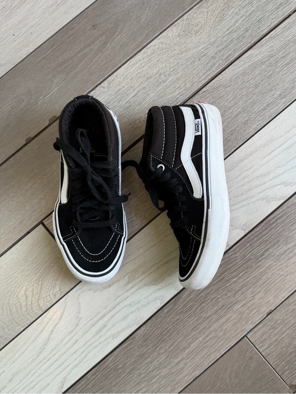 Vans Sk8-Mid Pro shoes in black and white.